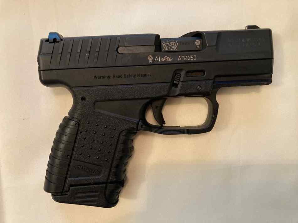 Walther PPS M1 9mm Pistol with accessories