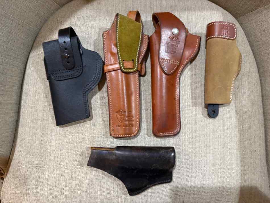 Five leather holsters