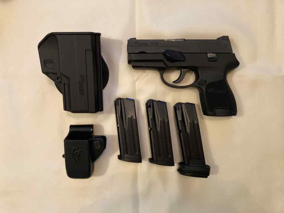 Sig Sauer P250 with accessories 9mm