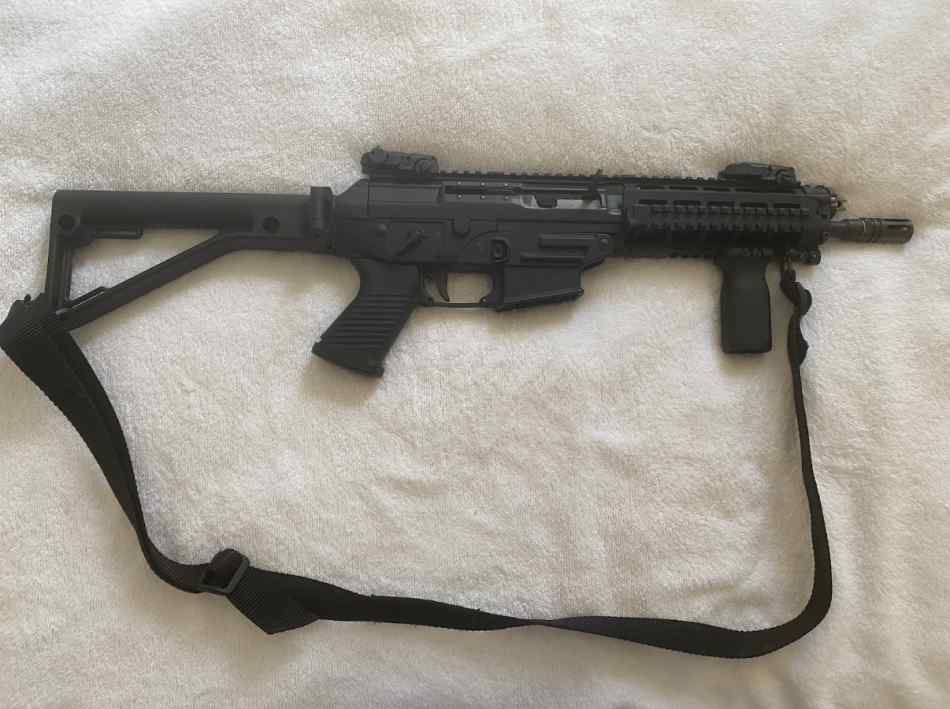 Real Sig Sauer 556 with folding stock.