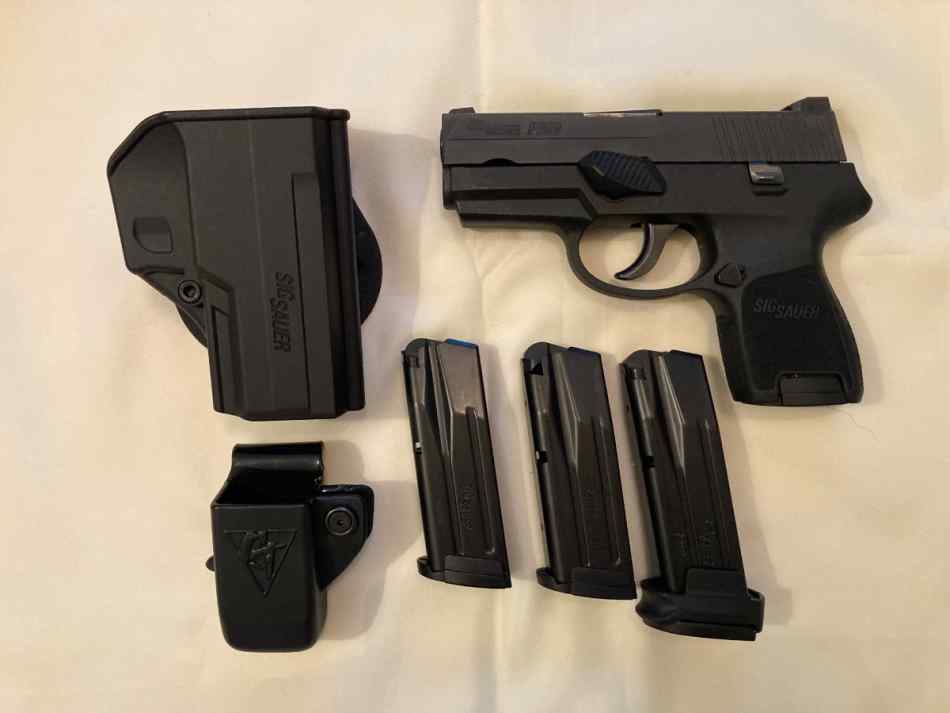 Sig Sauer P250 with accessories. 